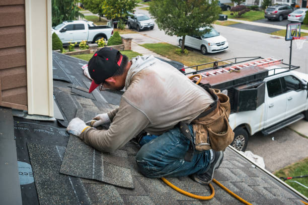 Professional Roofing technician working in Eastport, NY